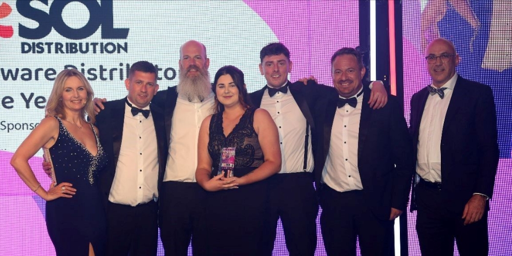 A photograph of the Sol Distribution team collecting the award for 'Hardware Distributor of the Year'